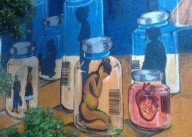 Detalle del mural de trata y tráfico en la UMSA